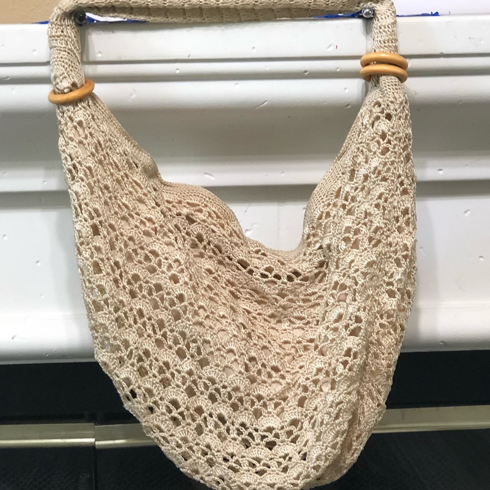 Tan see through hobo bag